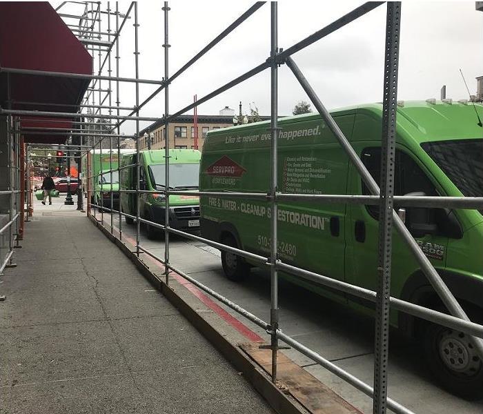 SERVPRO vehicles parked outside building while responding to an emergeny